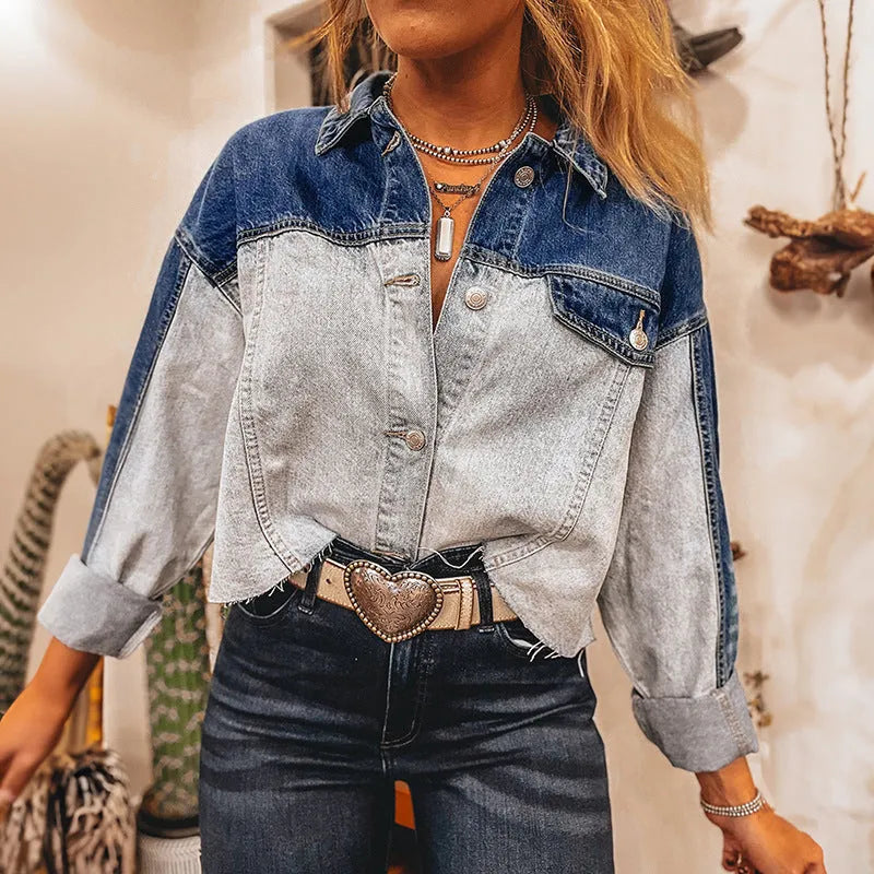 Loose fit women's denim coat with multi-buckle front on hanger.