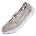 Women's flat casual shoes in beige with mesh upper and round toe, shown from the side.
