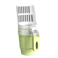 Grey foldable cat litter scoop and bin system with non-slip handle next to a litter box.