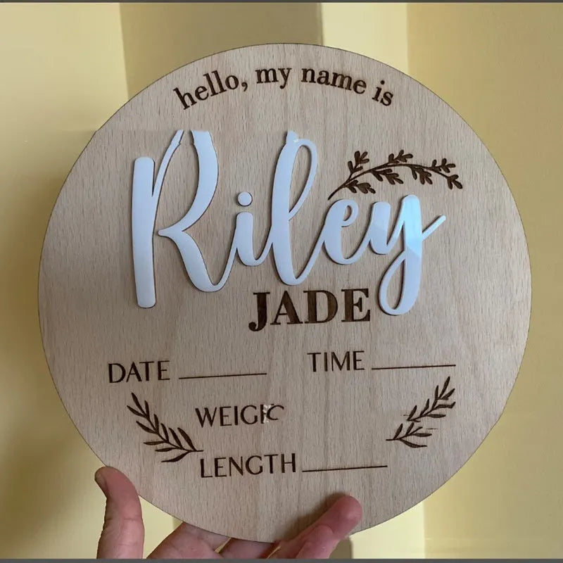 Square wooden baby birth announcement plaque showing newborn name and details