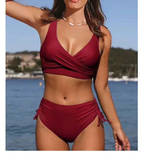 Women's solid colour bikini with cross-strap back, briefs bottom, in nylon fabric.