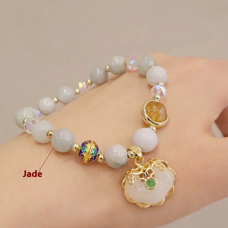 Geometric ethnic style jade bracelet with three-dimensional metal decorations in grey jade or strawberry quartz