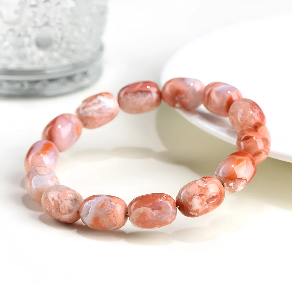 Natural cherry agate bracelet with barrel-shaped beads and ruyi design elements