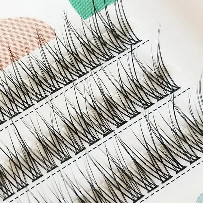 Black V-shaped fairy fishtail false eyelashes with thick segments, shown in 10mm length.