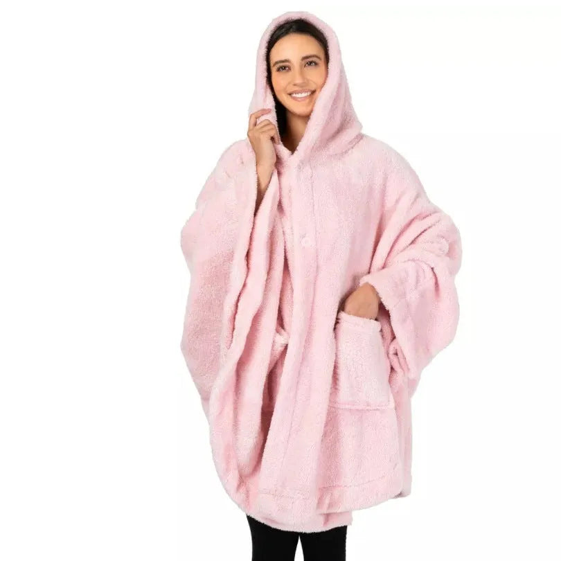 Thick hooded long sleeve bathrobe in black hanging on a hook