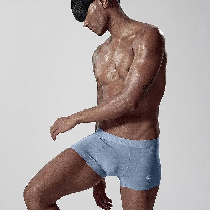 Men's seamless modal underwear in mid waist style showing hip lifting and body shaping design