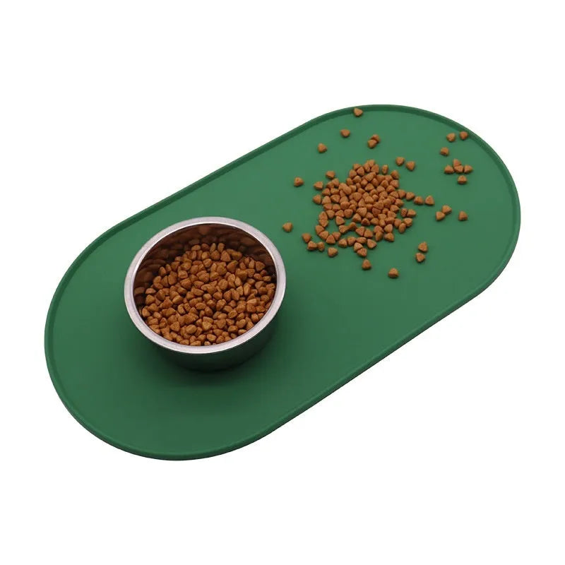 Green silicone waterproof pet feeding placemat with a food bowl on it.