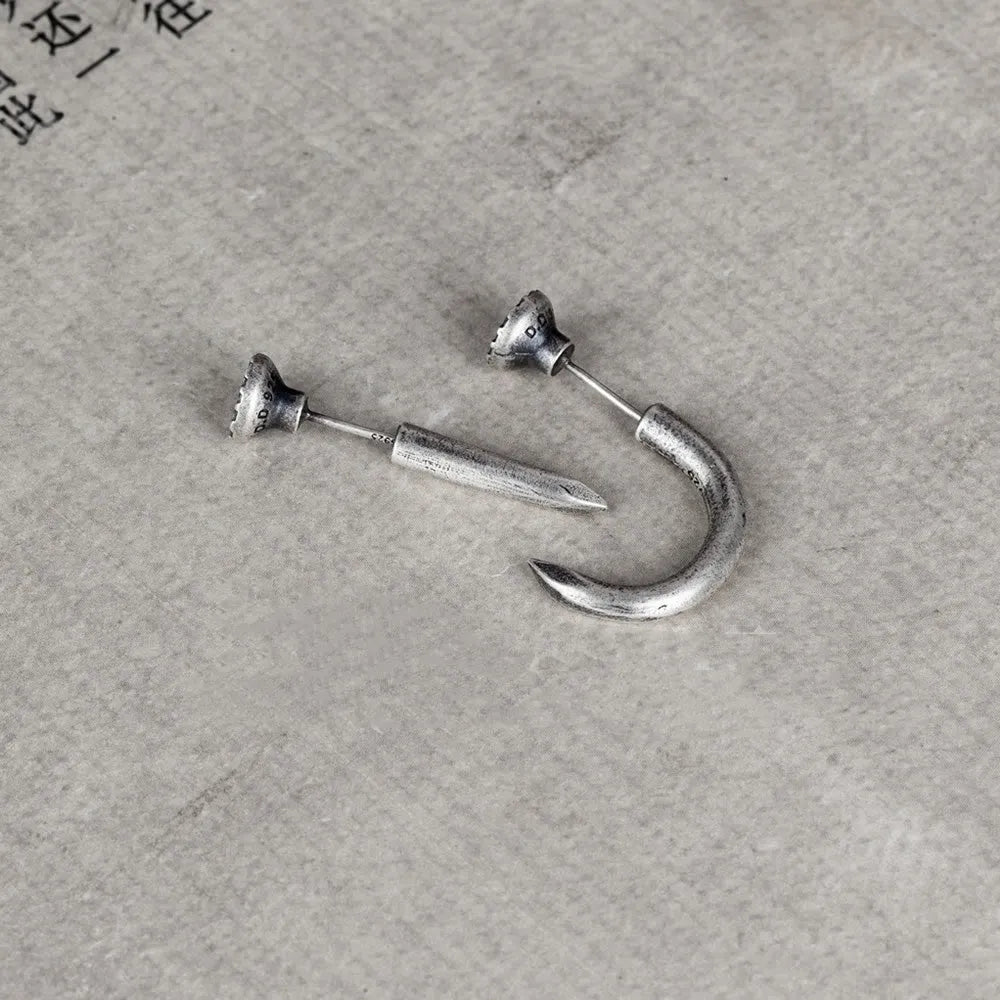 Sterling silver nail stud earrings in straight or curved punk style on ear hook.