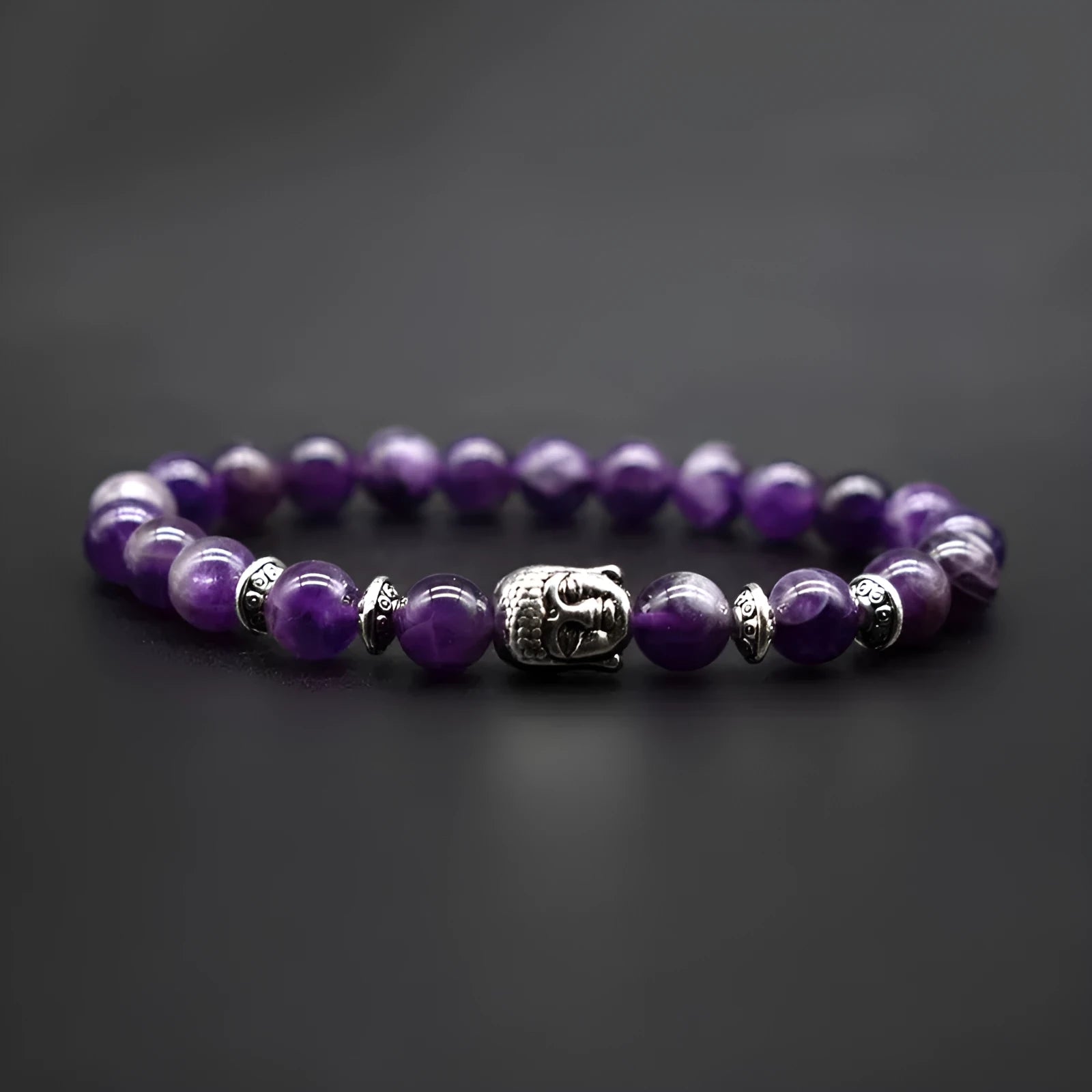Handcrafted unisex bracelet with a 19mm Buddha head bead in amethyst, tiger eye, black agate, pink crystal, or green gold.