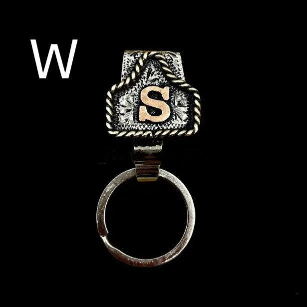 Handmade metal cow tag belt key holder keychain on a key ring, showing the metal loop and tag design.