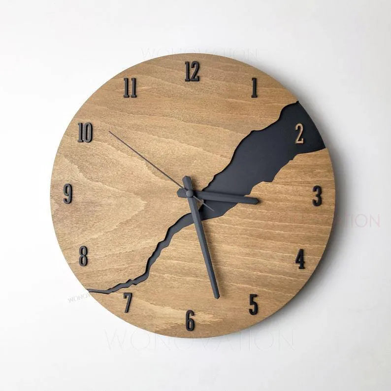 Modern simple wooden wall clock with Arabic numerals on face, shown in a neutral colour finish.