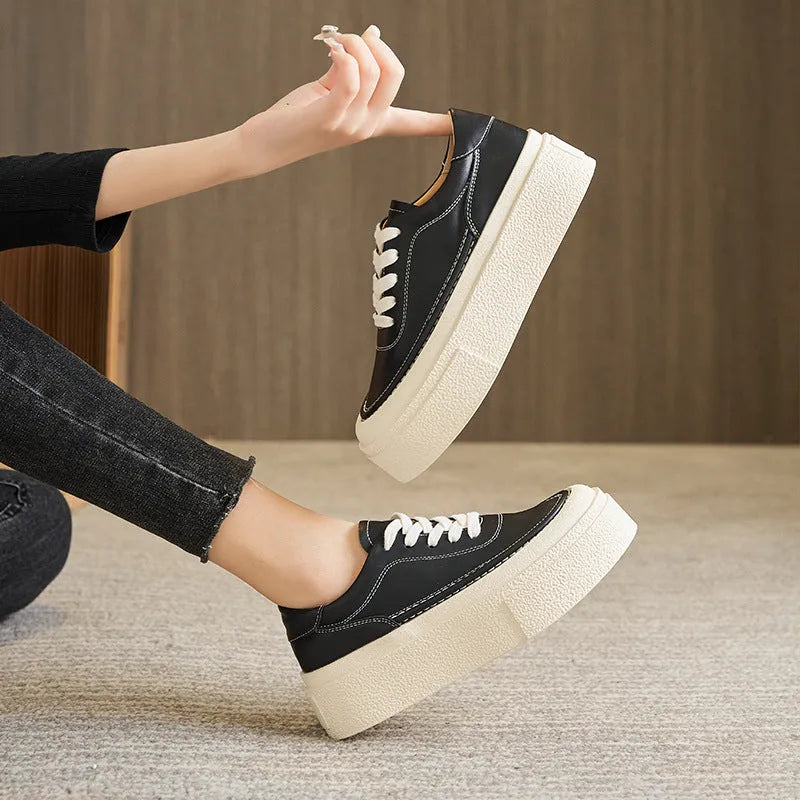 Women's black and white platform casual sports shoes with cowhide leather upper and round toe.