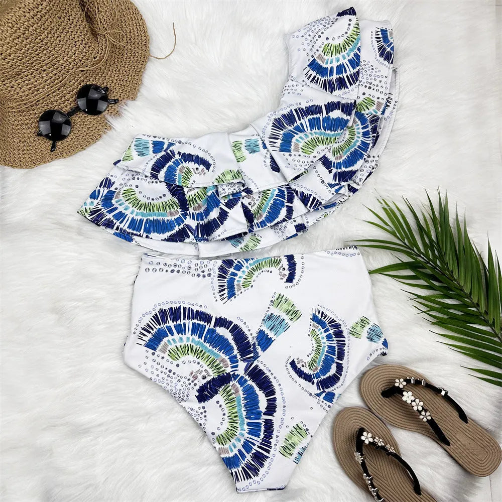 White women's one-shoulder swimsuit with lotus leaf detail and split design