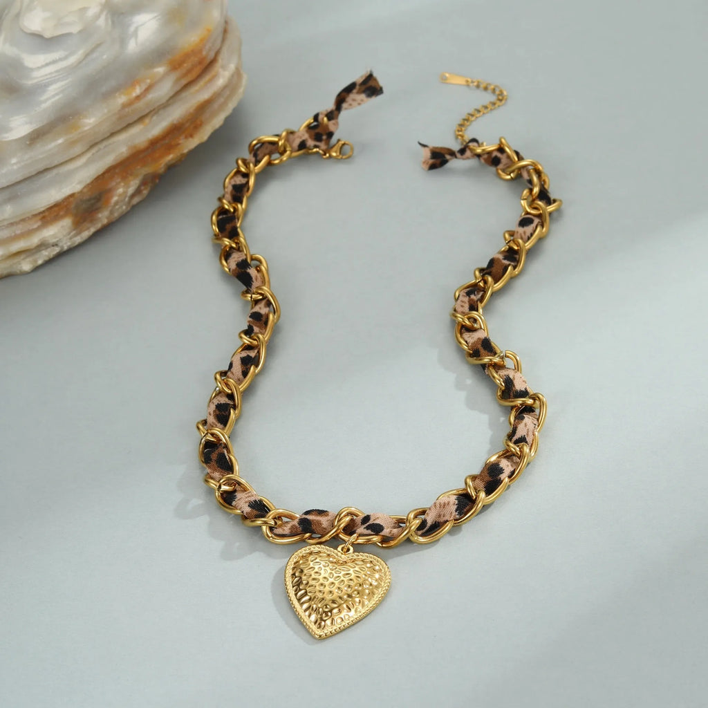 Geometric leopard love pendant on stainless steel chain with 18K electroplated finish