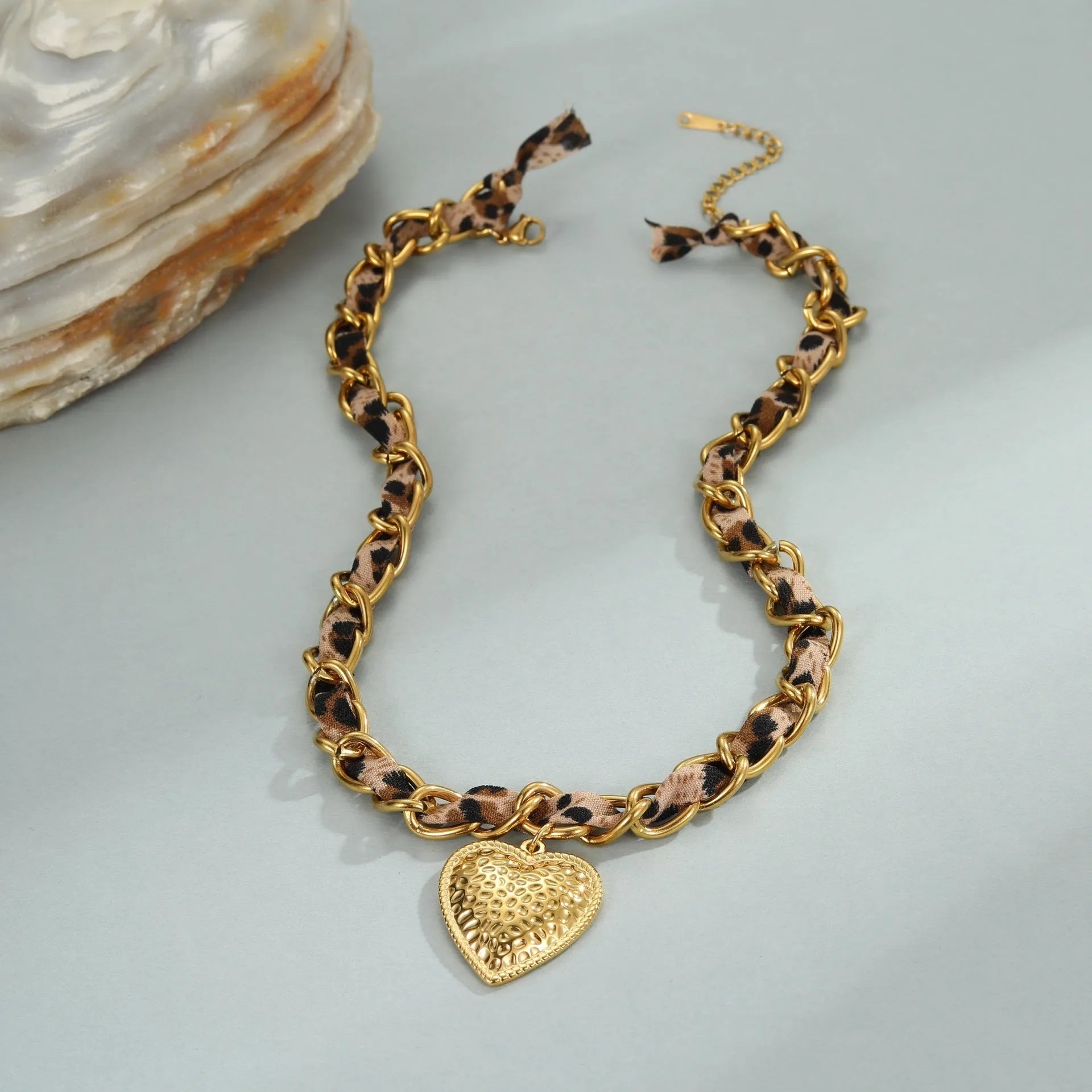 Geometric leopard love pendant on stainless steel chain with 18K electroplated finish