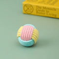 Handmade plush cotton cat hair ball toy in mixed colours, shown next to a ruler indicating 5cm size.
