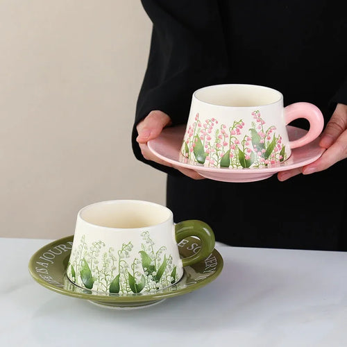 Ceramic coffee cup and saucer set with two cups, two plates, and two spoons in 300ml capacity