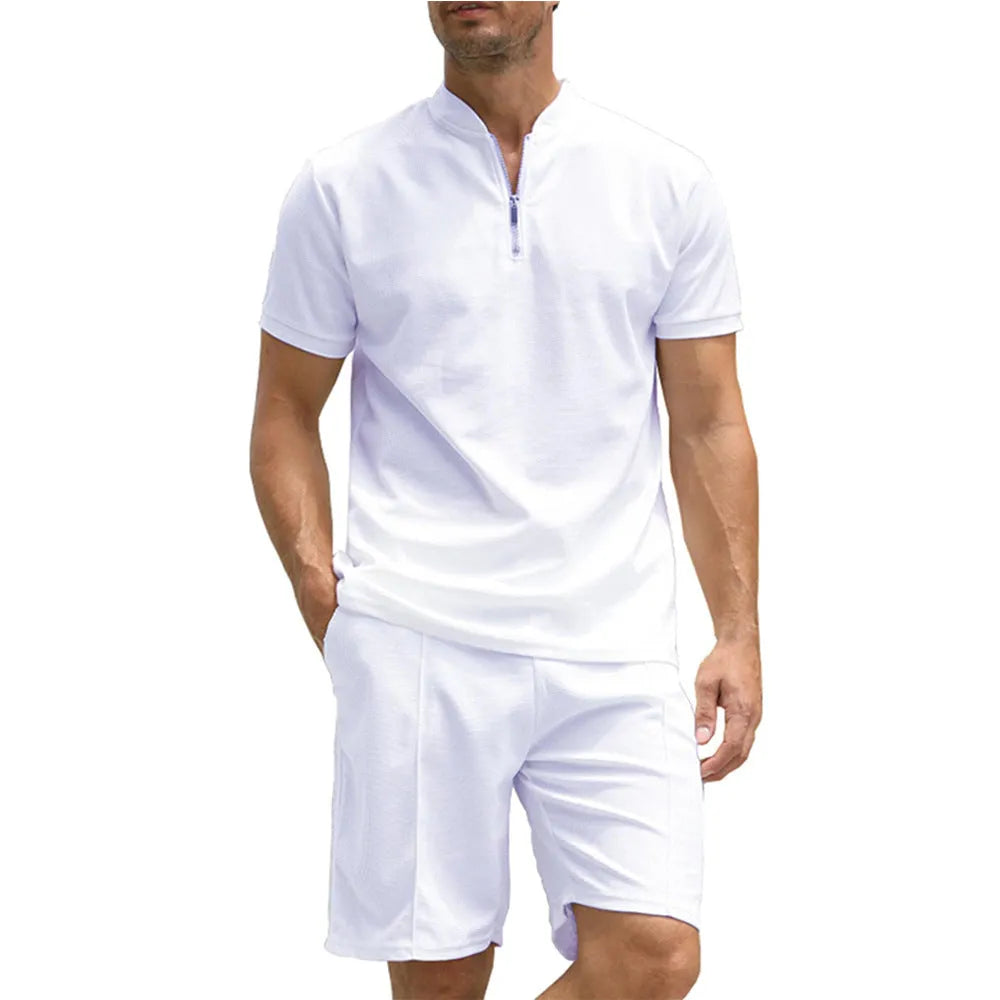 Men's solid colour short sleeve polo shirt and matching trousers two-piece set on a hanger.