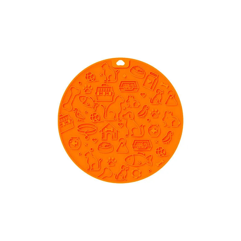 Round silicone pet licking mat with suction cup base in blue colour on smooth surface
