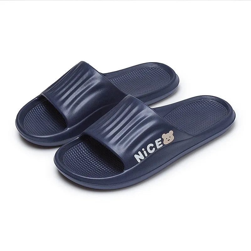 Pair of minimalist EVA flip flop slippers in a choice of six colours, showing the injection moulded non-slip sole.