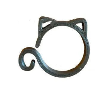 Red cat-shaped plastic gardening clip for plant support on green leaves