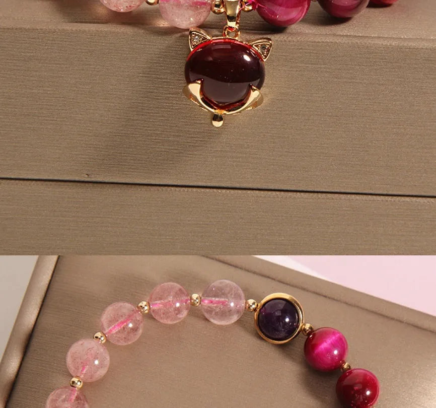 Strawberry crystal elastic bracelet for women on a white background.