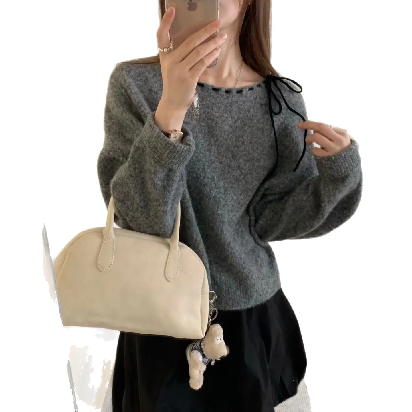 A grey loose-fitting women's knitwear pullover made from regenerated cellulose fibre.