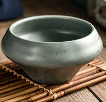 Porcelain Japanese soup bowl in stone conch shape with underglaze finish