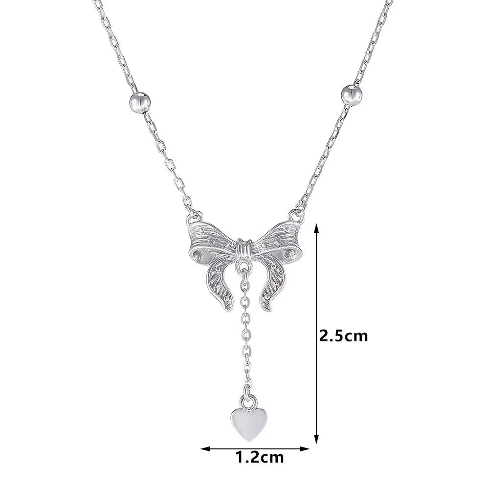S925 silver butterfly heart necklace on adjustable O-ring chain showing heart pendant with bow and butterfly details
