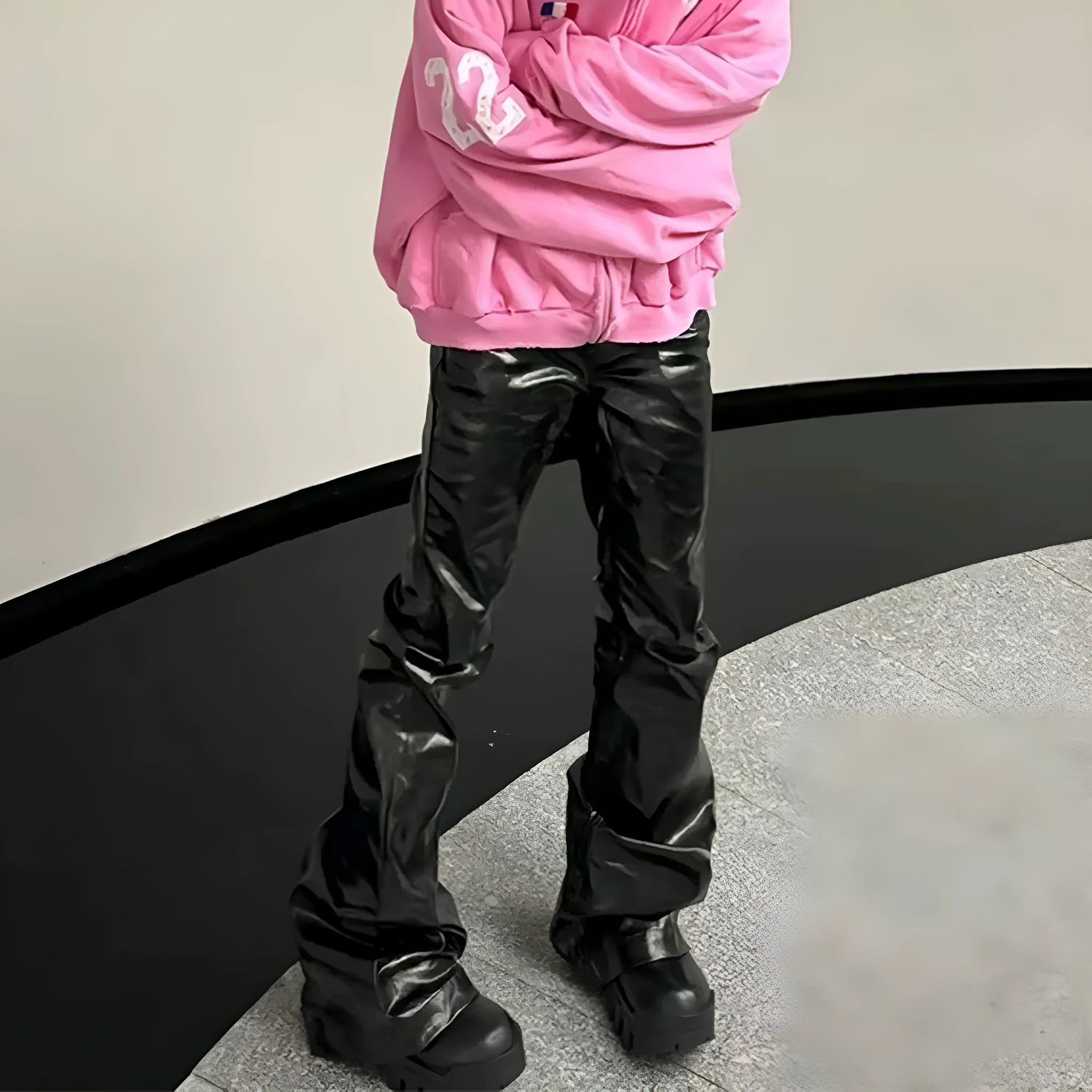 Black shiny patent leather skinny jeans with straight leg cut and mid-rise waist