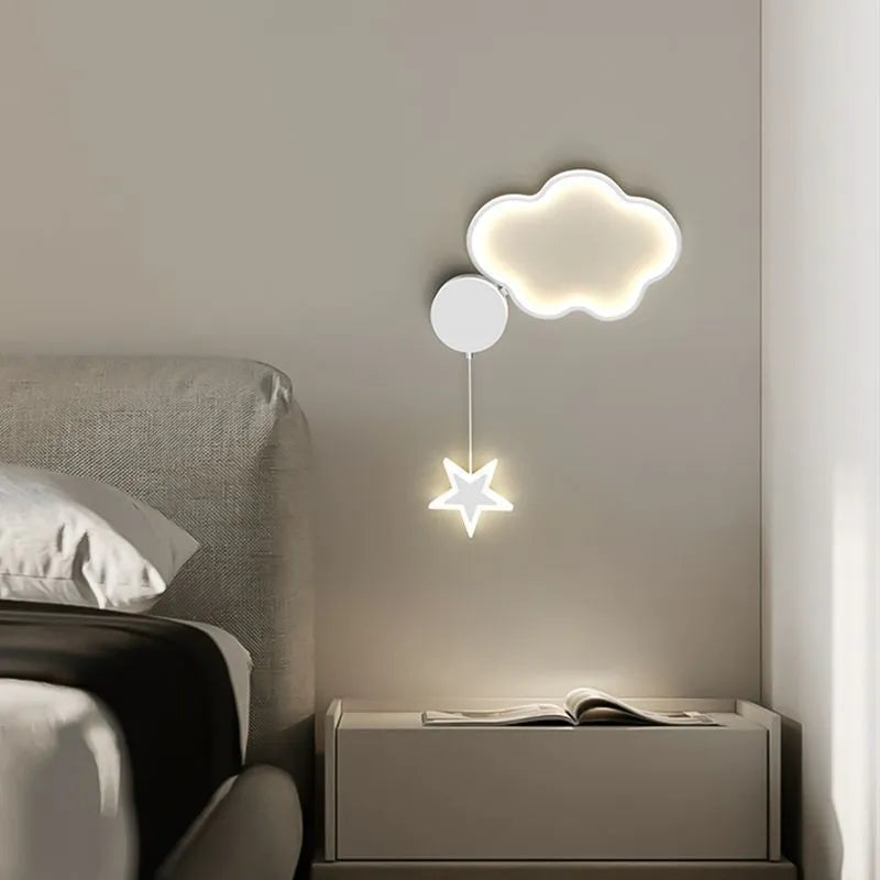 Children's bedside wall lamp with cloud and star design in black finish showing three-colour LED illumination