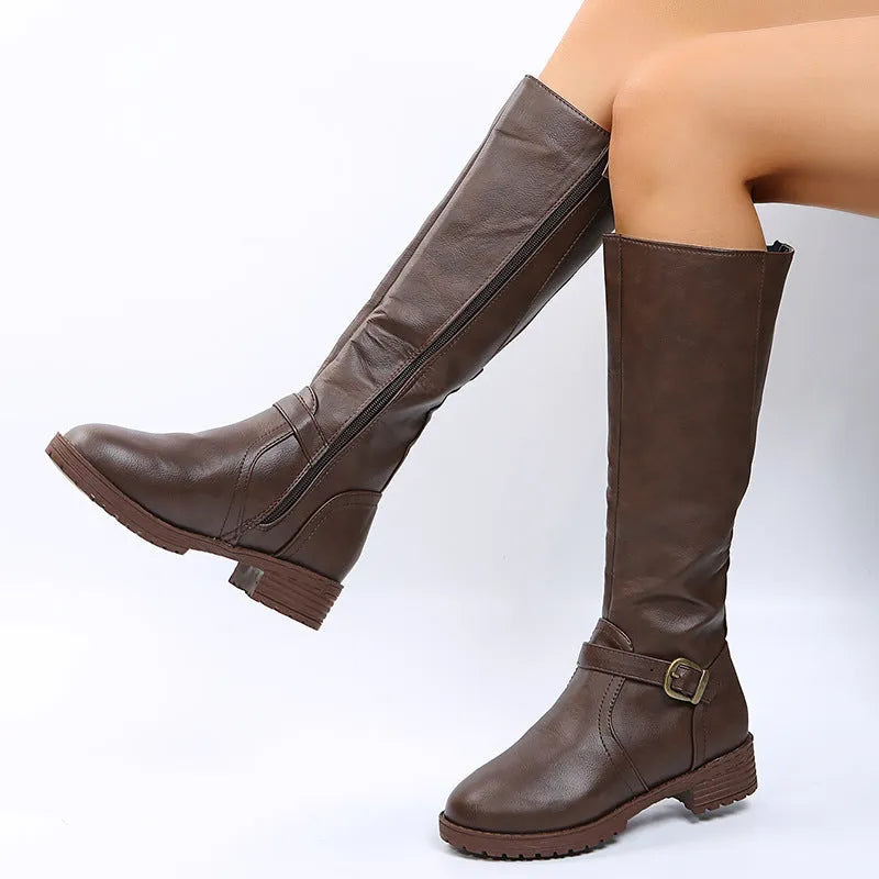 Women's black knight high boots with a square heel, round toe, and a belt buckle detail on the upper.