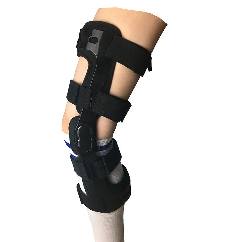 Black anterior ligament knee pad with adjustable straps shown from side view