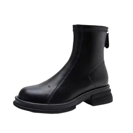 Women's black ankle boots with a flat heel, round toe, and a back zip fastening on a rubber sole.