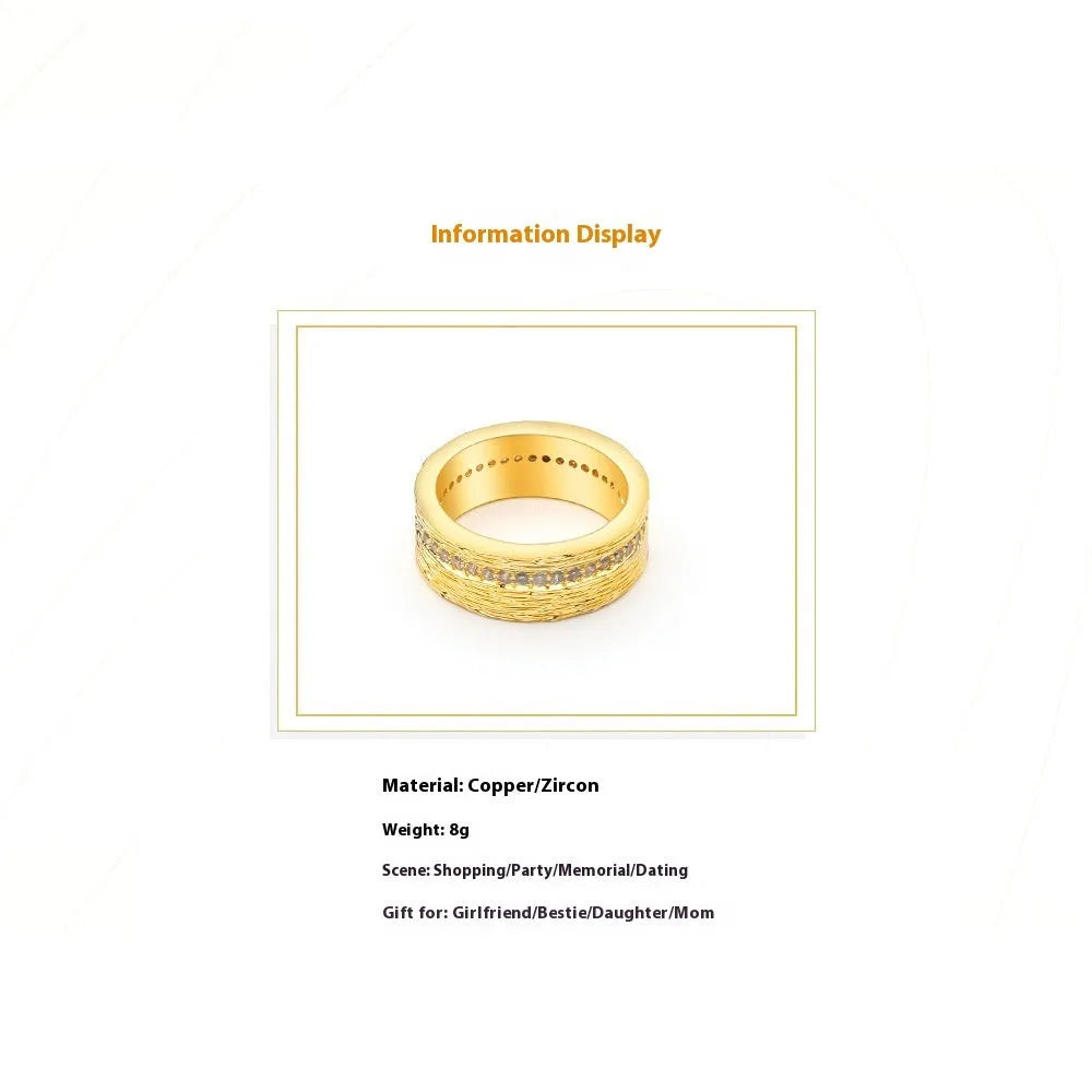 Gold-coloured geometric zircon ring for women showing openwork design and stone detail