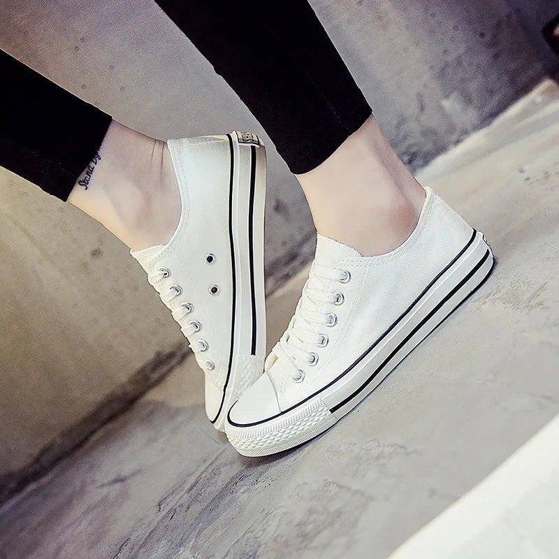 Women's solid colour casual canvas shoe on a white background.