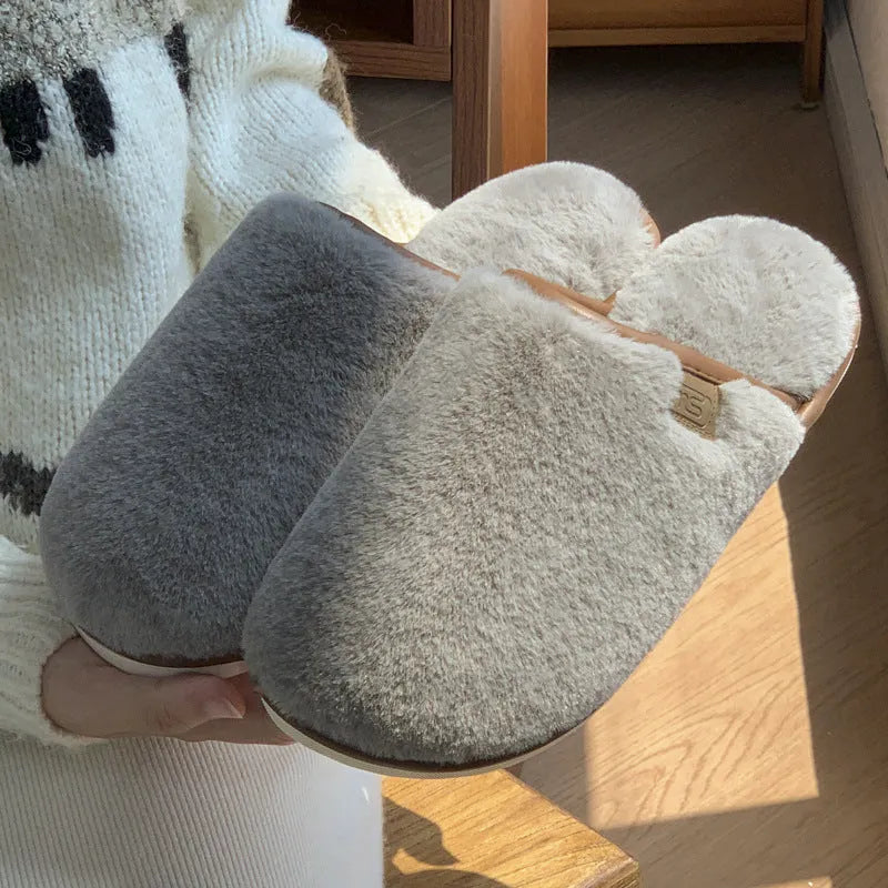 PVC non-slip winter slipper in a solid colour on a wooden floor.
