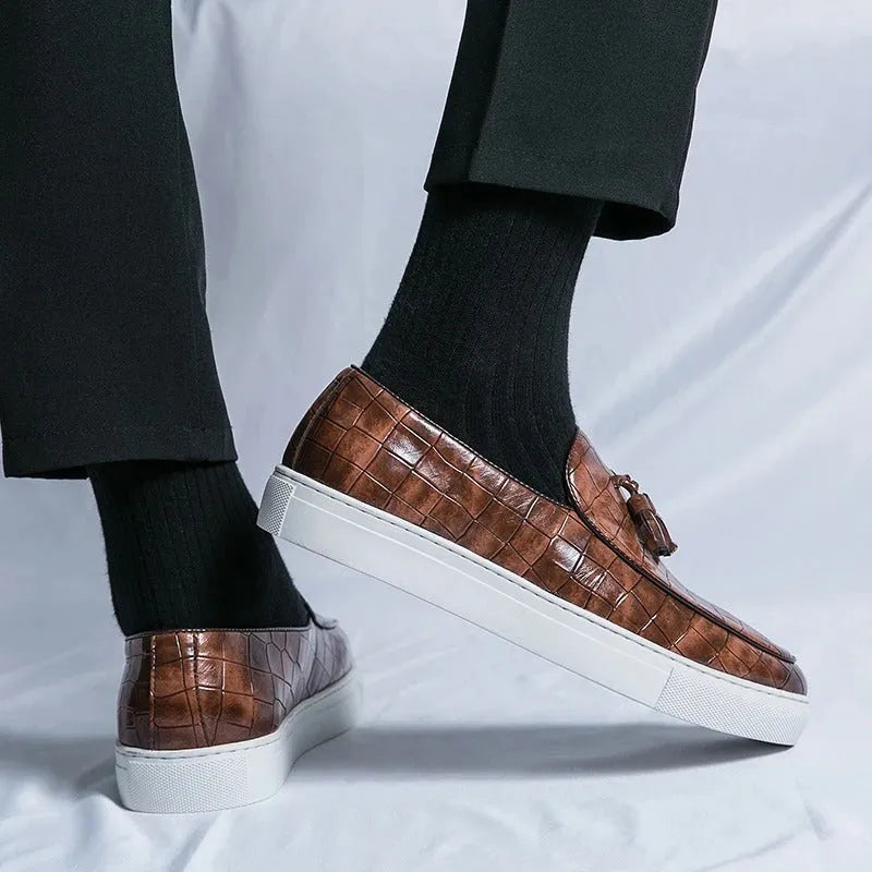 Men's black casual sneakers with a tassel detail on the artificial PU upper and a round toe.