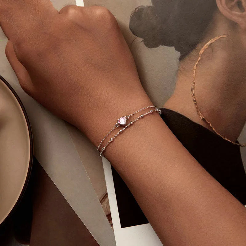 Women's sterling silver heart bracelet with adjustable chain and 6mm pendant