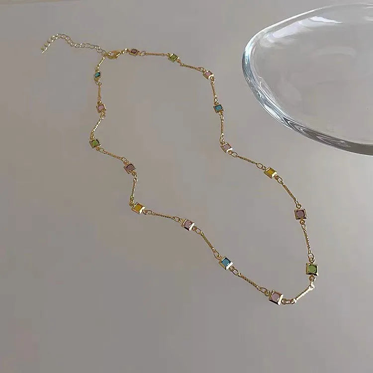 Square geometric clavicle necklace with artificial crystals in gold or white K tone