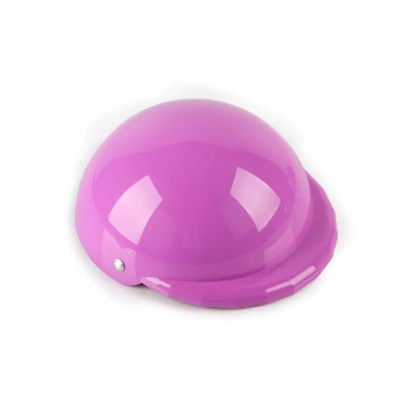A pink plastic motorcycle cap helmet for a dog, shown alongside white, black, and yellow colour options.