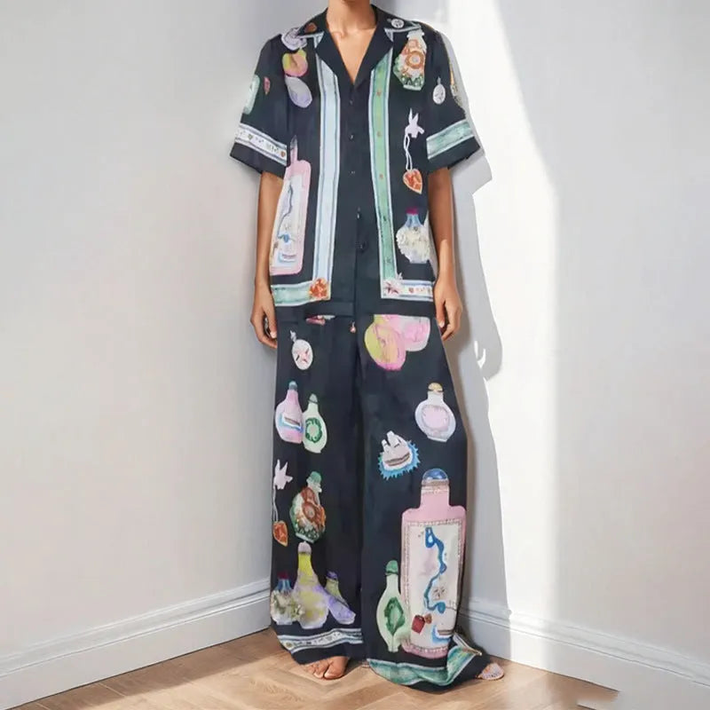 Black women's casual set with cartoon print cardigan top and matching trousers
