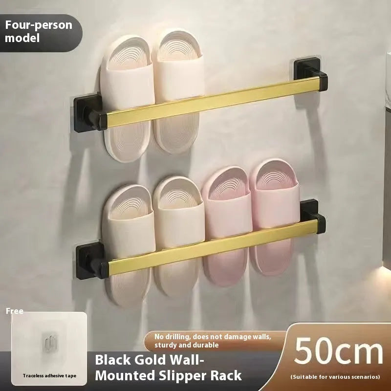 Black wall-mounted slipper rack with a small seat, shown holding two pairs of slippers.