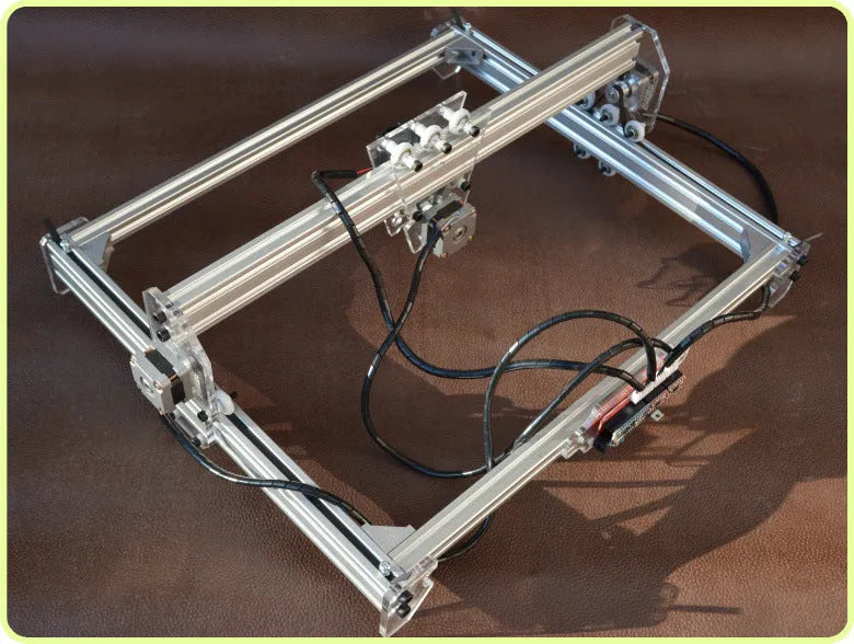 Miniature laser engraving machine with 3000mW output and 400x300mm base dimensions