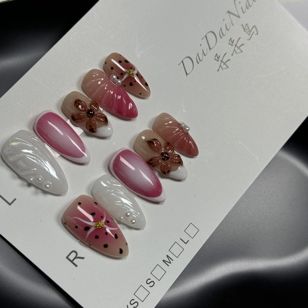 Hand-painted three-dimensional embossed nail art patches in candy colours, showing almond shape.