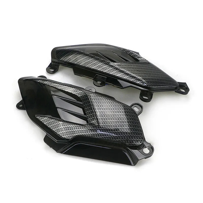 Pair of Yamaha NMAX replacement LED side lamps with carbon fibre decoration, showing blue or red light option.