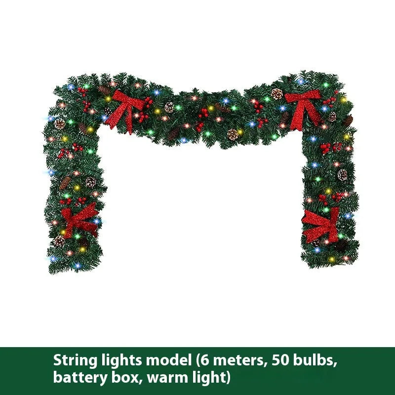 Christmas rattan pine cone bow decorative centrepiece with LED lighting on wooden table