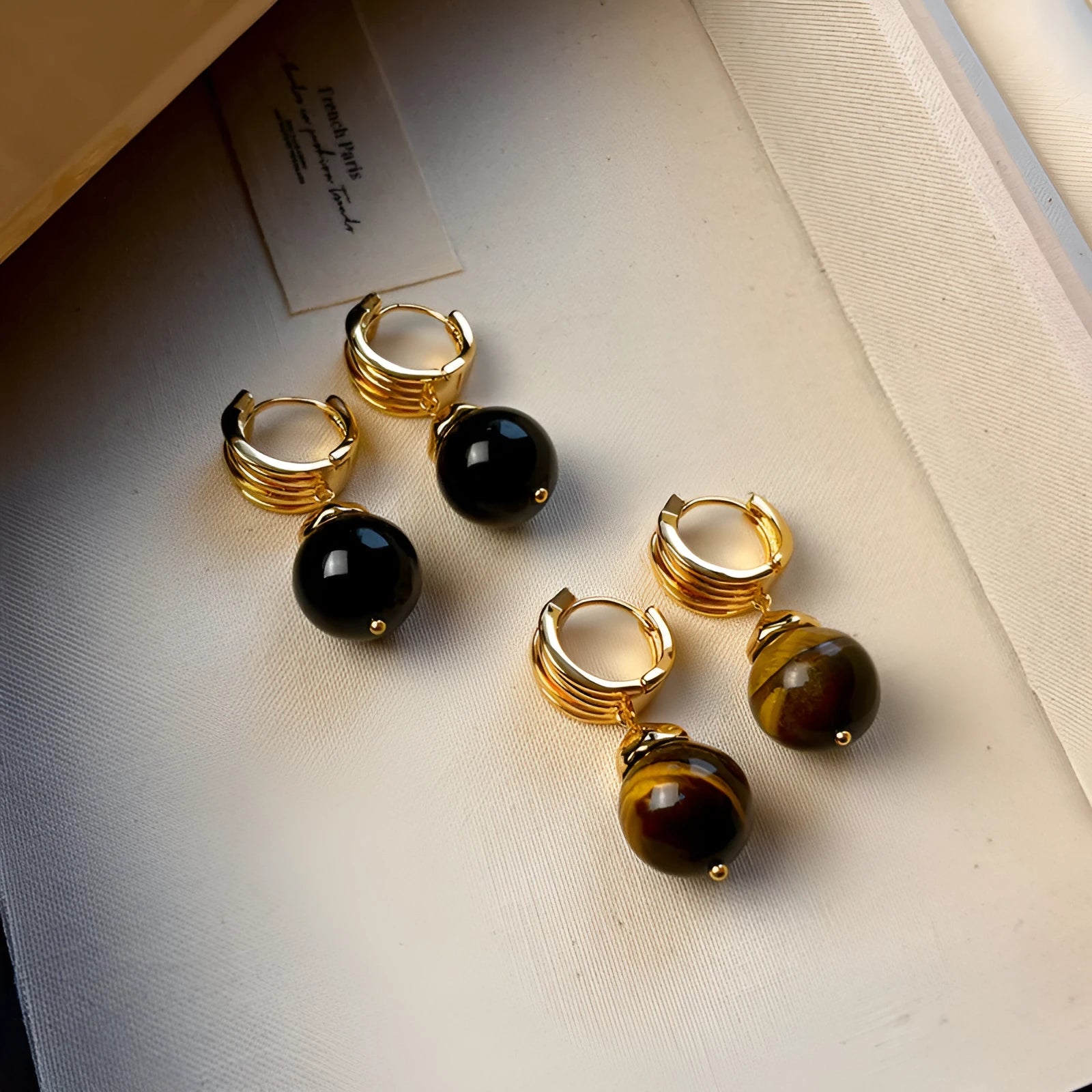 Tigereye geometric stud earrings with gold plating in brown and black colour options