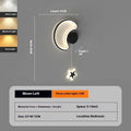 Children's bedside wall lamp with cloud and star design in black finish showing three-colour LED illumination