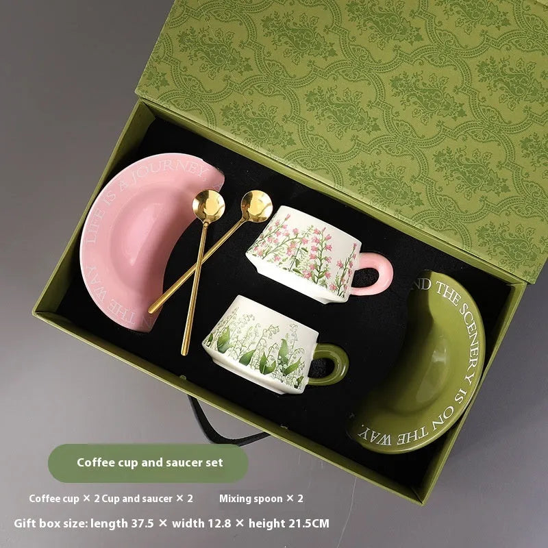 Ceramic coffee cup and saucer set with two cups, two plates, and two spoons in 300ml capacity